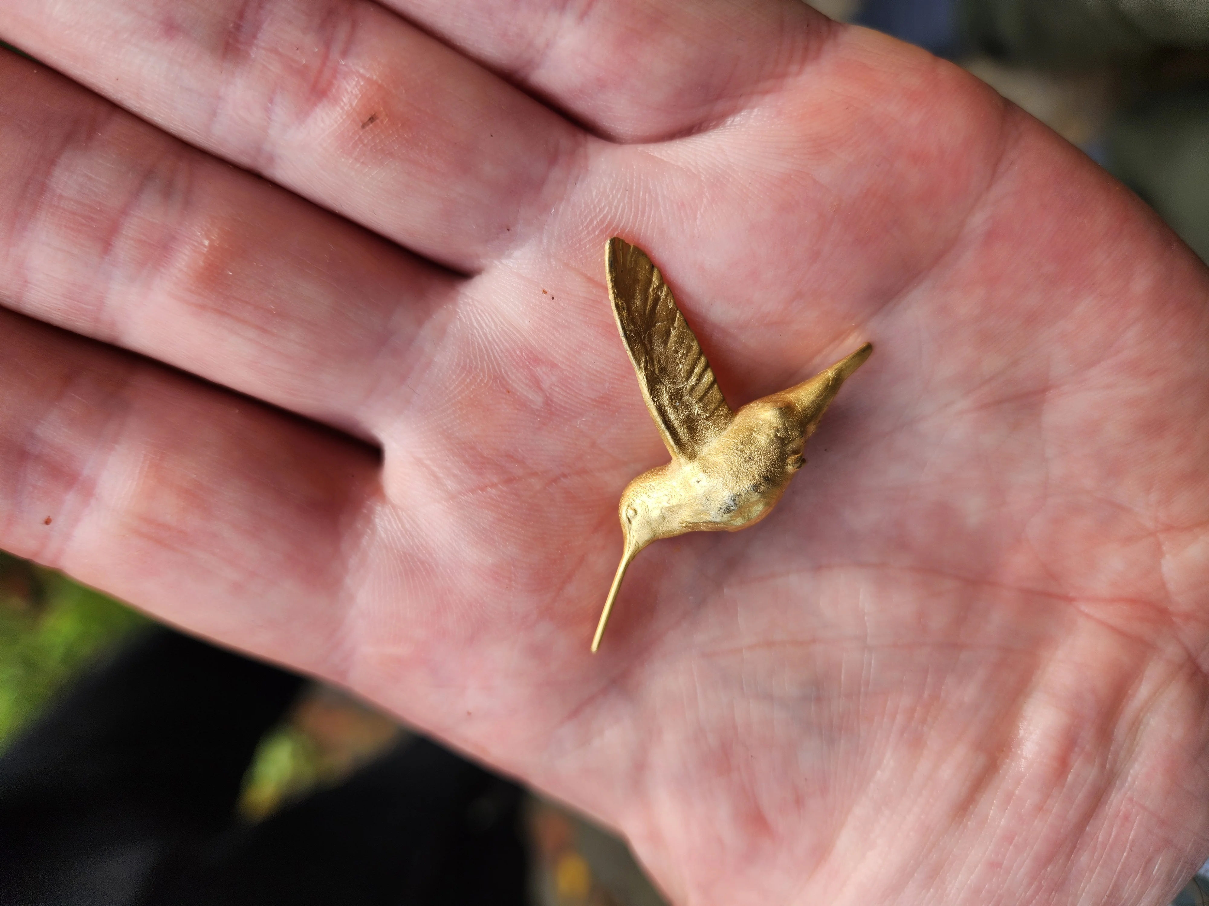 Gold plated hummingbird pin after casting